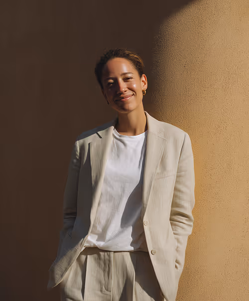 A professionally dressed woman representing trust, expertise, and strong leadership in architectural project management.